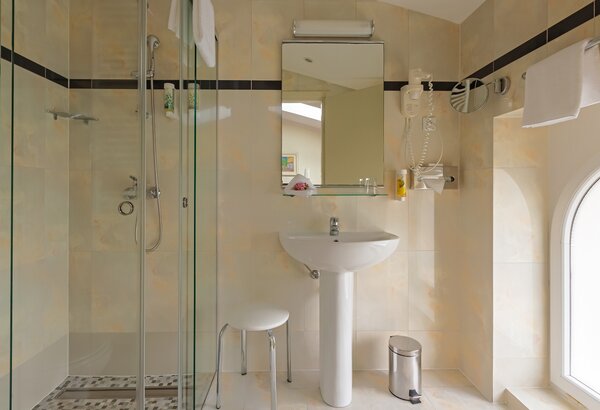 Bathroom in a land-side attic single room Single room at the historic hotel in Crikvenica