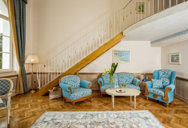 Historic hotel suite with seating area at Kvarner Palace Imperial suites at the sea view hotel in Croatia